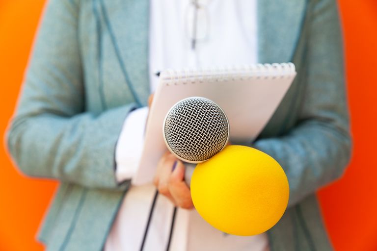 Female reporter at press conference or media event