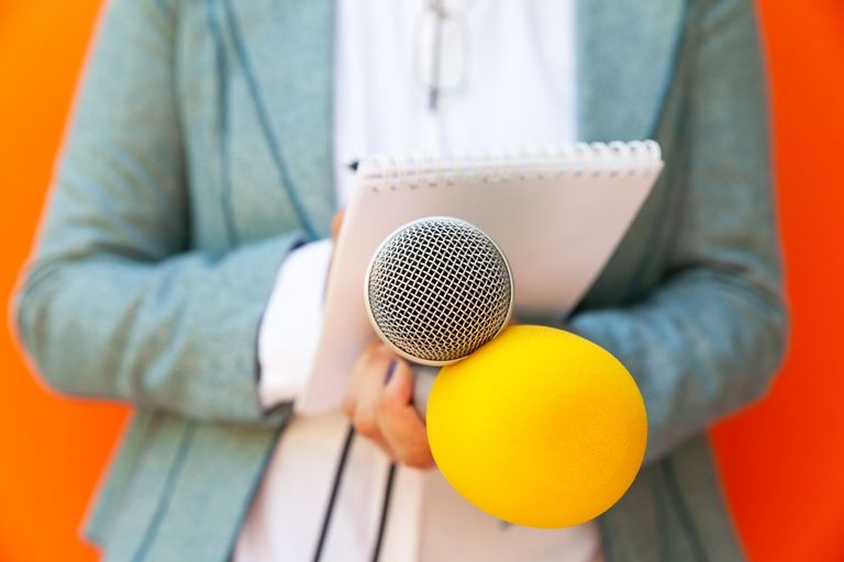 Female reporter at press conference or media event